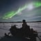 Arctic Aurora Chase by Snowmobile