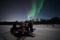 Arctic Aurora Chase by Snowmobile