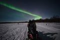 Arctic Aurora Chase by Snowmobile