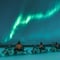 Northern Lights safari and meeting reindeer on electric snowmobiles in Rovaniemi