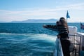 Traveler photographing whales from a boat near Reykjavík