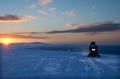 Driving a snowmobile through the Arctic wilderness