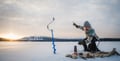 Ice fishing at the frozen lake