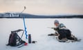 Ice fishing at the frozen lake