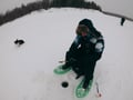 Ice fishing at the frozen lake