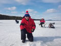 Ice fishing at the frozen lake