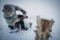 Ice fishing at the frozen lake