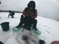 Ice fishing at the frozen lake