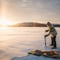 Ice fishing at the frozen lake