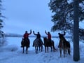 A small group horseback riding tour in the snow