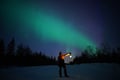 Northern lights picnic by the lake, Rovaniemi, Lapland, Finland