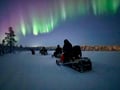 Chasing the Northern Lights by snowmobile