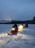 Chasing the Northern Lights by snowmobile and homemade dinner