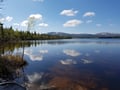Arctic summer SUP boarding on a lake and river