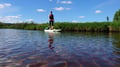 Arctic summer SUP boarding on a lake and river