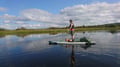 Arctic summer SUP boarding on a lake and river