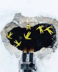 People floating in a frozen river