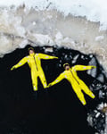A couple floating in a frozen river