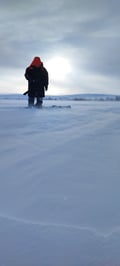 Ice fishing experience on an Arctic lake