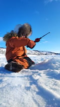 Ice fishing experience on an Arctic lake