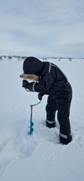 Ice fishing experience on an Arctic lake