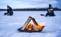 Ice fishing on a frozen lake