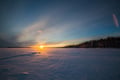 Ice Fishing on frozen lake in Levi