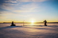 Ice Fishing on frozen lake in Levi