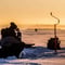 Ice fishing on a frozen lake