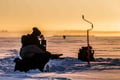 Ice Fishing on frozen lake in Levi