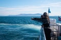 Traveler watching whales from a boat near Reykjavík Iceland