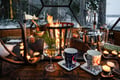 Dinner in a Glass Igloo Under Northern Lights
