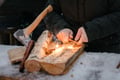 Bushcraft fire-starting with birch tinder during a winter tour in Rovaniemi