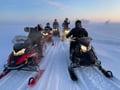 Husky and Snowmobiles Galore